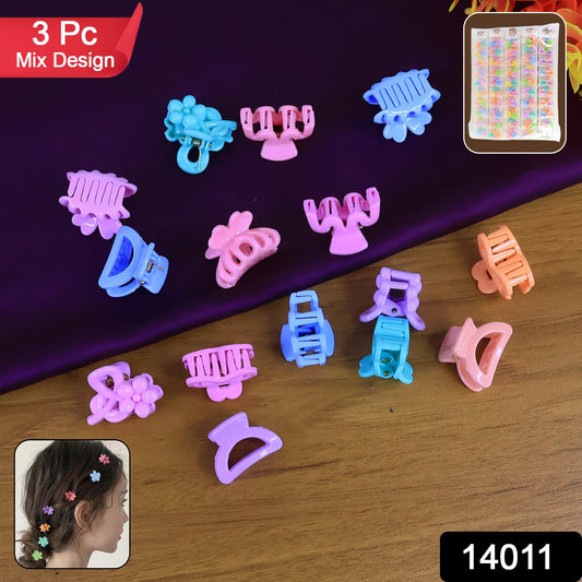 Close-up of assorted vibrant mini hair claw clips in various colours.