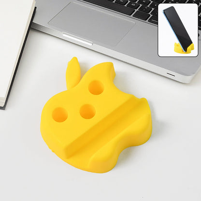 Apple-shaped plastic mobile stand with pen holder on desk supporting a smartphone
