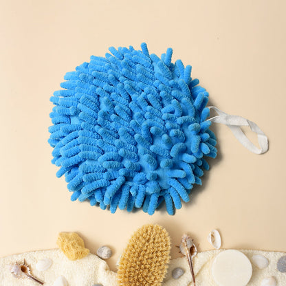 Microfiber hand towel with loop, conveniently hanging on a kitchen faucet.