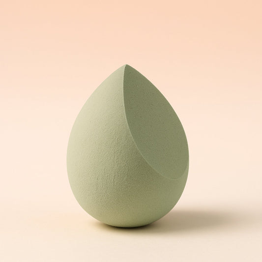 Close-up shot of the soft, non-latex texture of the BeautyBare makeup sponge.