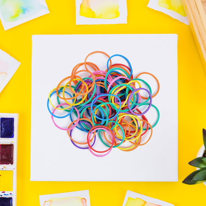 Assorted multicolor elastic bands serving office, school, and home needs.