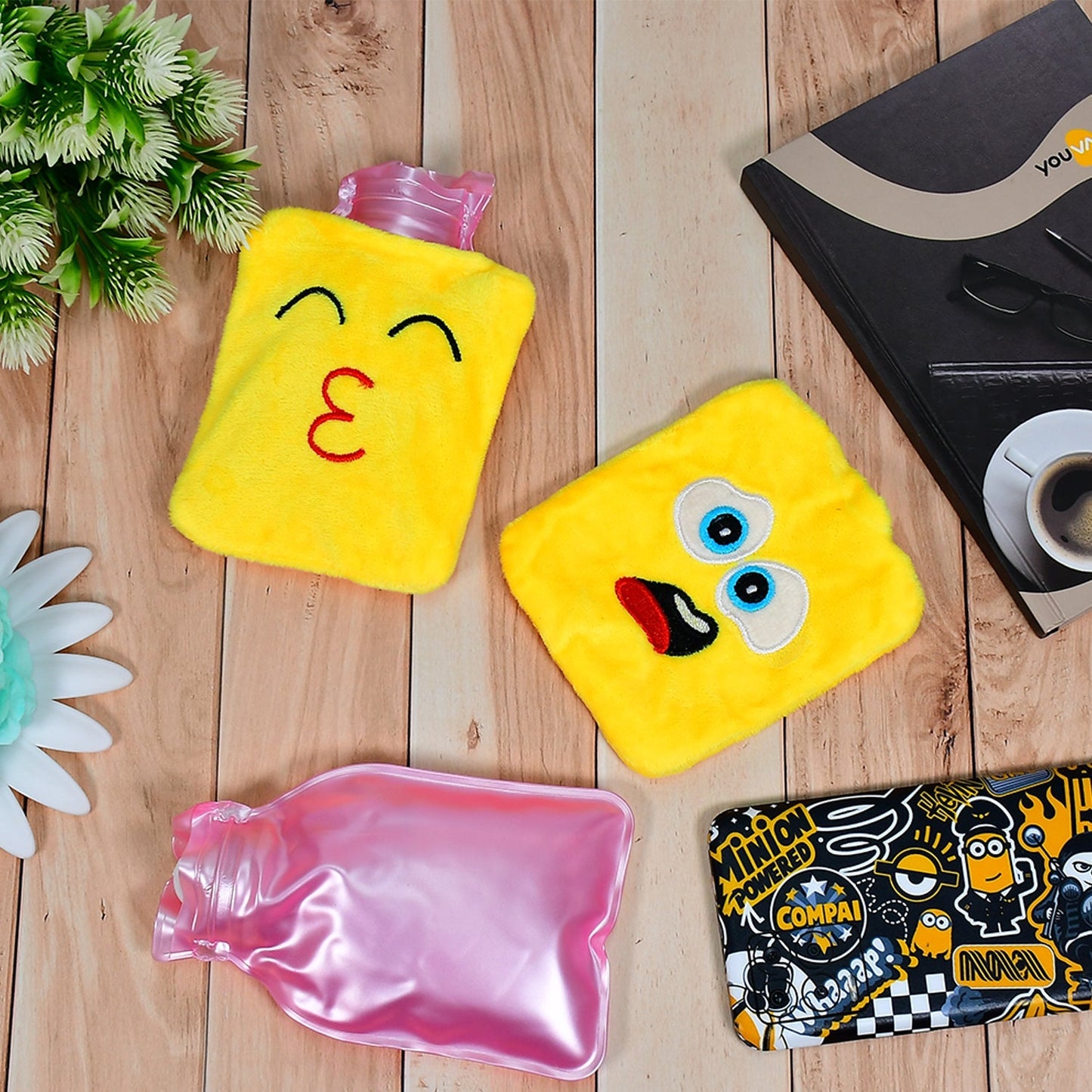 Small hot water bag featuring a playful emoji print for effective pain relief.