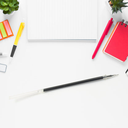 Various angles of the InkGlow black pen refill, showcasing its complete structure.