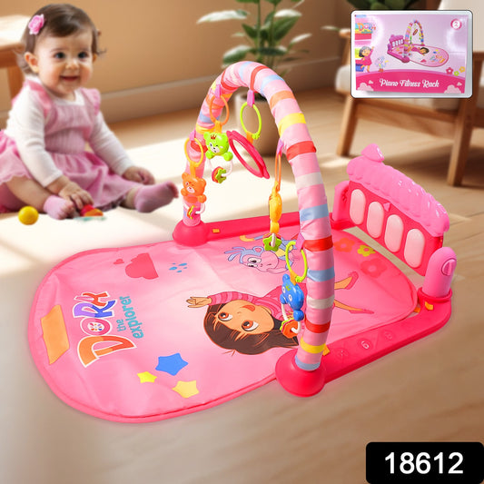 Infant kicking the musical piano on the Aditi baby play gym mat.